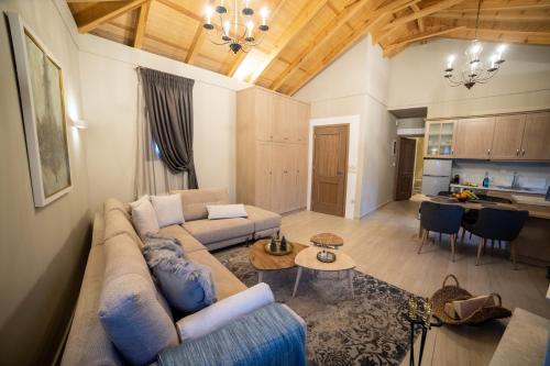 a living room with a couch and a table at Casacaldametsovo in Metsovo