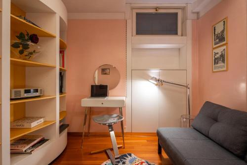 a living room with a couch and a table at Casa Flavia ai Morosini - Luxury apartment with Canal View in Venice