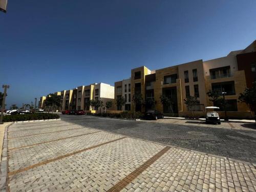 an empty street in front of a building at Mangroovy Seafront condo - Great Kite Surfing in Hurghada