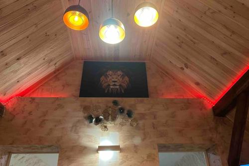 a room with a painting of a tiger on the wall at Villa Spacieuse SPA Sauna Billiard Netflix in Strasbourg
