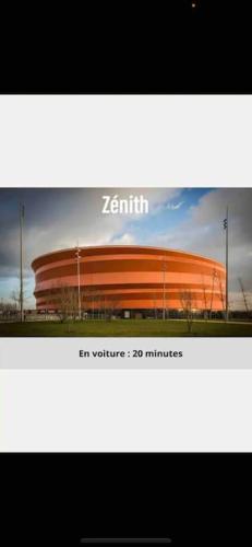 a picture of a stadium with a building at Villa Spacieuse SPA Sauna Billiard Netflix in Strasbourg