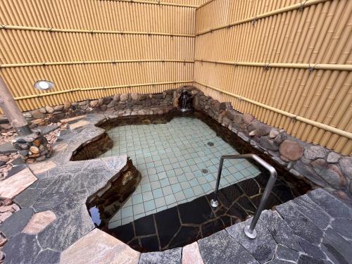 a small pool of water in a corner of a building at Monbetsu Prince Hotel in Mombetsu