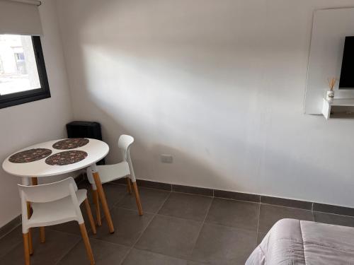 a small kitchen with a table and chairs in a room at Monoambiente parque p in Villa María