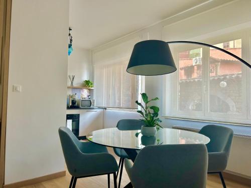 a dining room with a table and blue chairs at Taormina Casa Sarina in Taormina