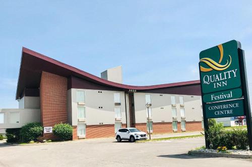 a car parked in front of a building with a sign at Quality Inn & Conference Centre Festival in Stratford