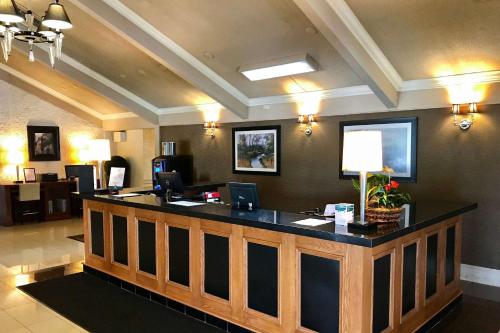a lobby with a reception desk in a hotel at Quality Inn & Conference Centre Festival in Stratford