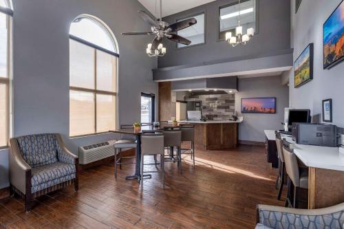 a large room with a dining room and a kitchen at Clarion Inn Kingman I-40 Route 66 in Kingman