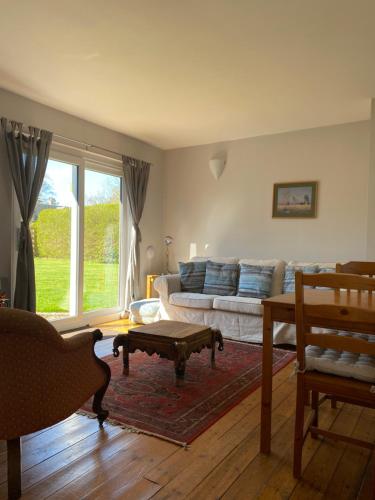 a living room with a couch and a coffee table at Gorton House and Cottages in Lasswade