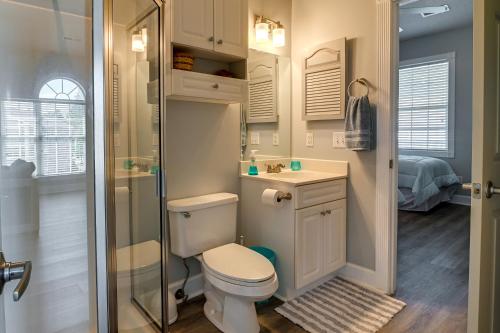 a small bathroom with a toilet and a shower at Idyllic Myrtle Beach Condo Golf Course On-Site in Myrtle Beach