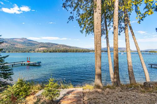 a dock on a lake with palm trees at Willow Bay in Priest River