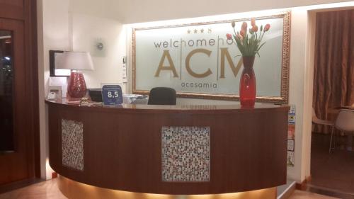 a welcome agent desk in a hotel room at ACasaMia WelcHome Hotel in Rimini