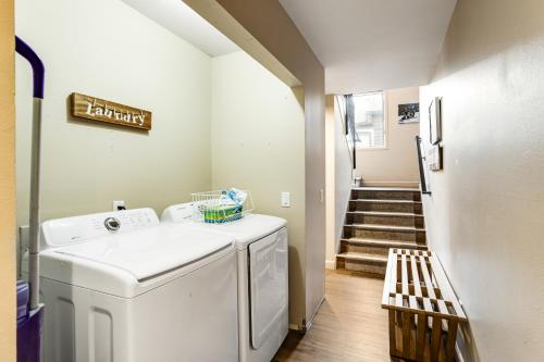 a laundry room with a washer and a staircase at Mount Royal in Frisco
