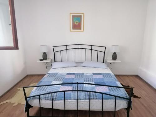 a bedroom with a bed with a metal frame at Apartments with parking space Dajla, Novigrad - 6935 in Novigrad Istria