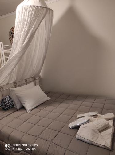 מיטה או מיטות בחדר ב-Farniente Tolo