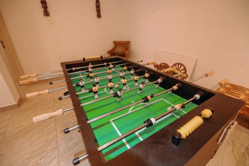 a group of people playing a game of snooker at Big chill stays in Apenkwa