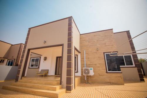 a rendering of a house with the front of it at Big chill stays in Apenkwa