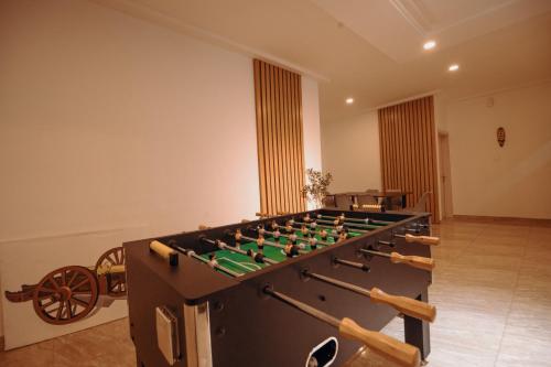 a large foosball table in the middle of a room at Big chill stays in Apenkwa