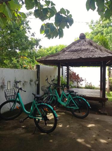 a group of bikes parked next to a gazebo at Follow The Rabbit Bungalow in Gili Air