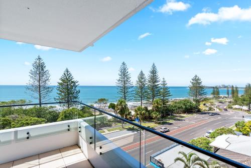 a balcony with a view of the ocean at Windward Apartments in Mooloolaba