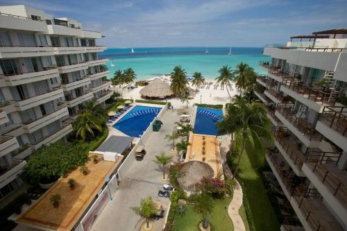 an aerial view of the beach and the resort at Ixchel Beach Hotel in Isla Mujeres