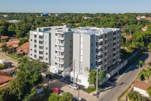 an overhead view of a white apartment building at Acogedor dpto! Zona Conmebol 505 in La Mercedes