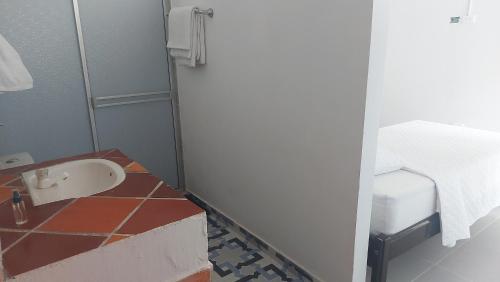a bathroom with a sink and a toilet at Mangüeña Alojamiento Rural in Palermo