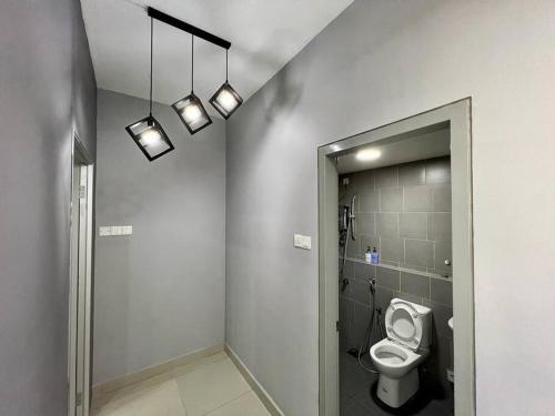 a bathroom with a toilet and a walk in shower at One Room Studio with WiFi and MRT in Seri Kembangan