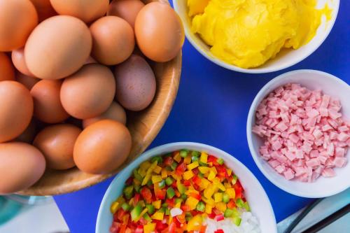 a table with eggs and different types of sprinkles at Hotel Zing in Pattaya South