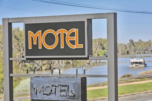 a sign for a motel with a view of a river at Mildura Riverview Motel in Gol Gol
