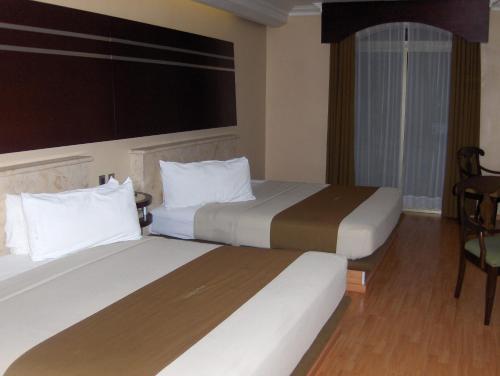 Postel nebo postele na pokoji v ubytování Hotel Dubrovnik