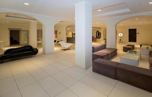 a living room with a couch and a table at Golden Beach in Hersonissos