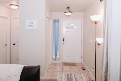 a bedroom with a white door and a white floor at Relax in Post Falls with No Noise Pollution in Post Falls