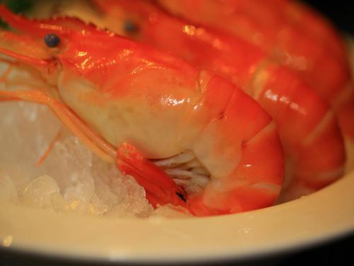 a lobster is sitting in a bowl of ice at Zhuhai Charming Holiday Hotel-Free Welcome Fruit Plate in Zhuhai