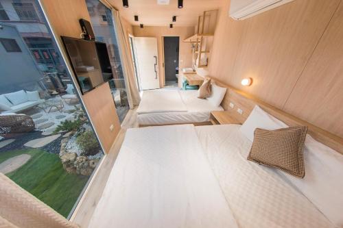 Katil atau katil-katil dalam bilik di Yuye Shanin CAMPING HUT