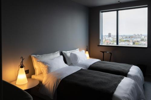 a bedroom with two beds and a window at Zonar Zagreb by Maistra City Vibes in Zagreb