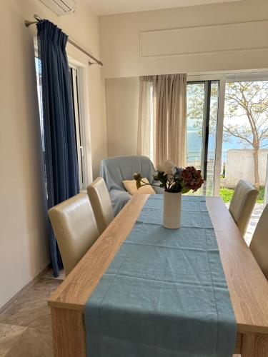 a dining room table with a blue table cloth on it at Villa pinelopi in Kalamata
