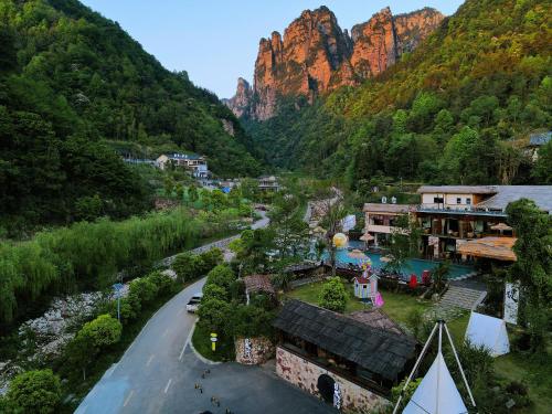 an aerial view of a village in the mountains at Homeward Mountain Resort in Zhangjiajie