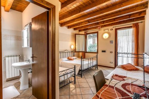 Postel nebo postele na pokoji v ubytování Agriturismo Pozzo Fiorito