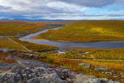 an aerial view of a river in the hills at Utsjoki Arctic Resort in Utsjoki