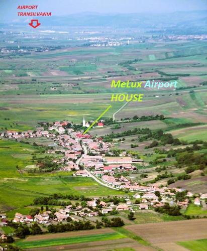 an aerial view of a town with a melk airport house at MeLux Airport House in Nicolești