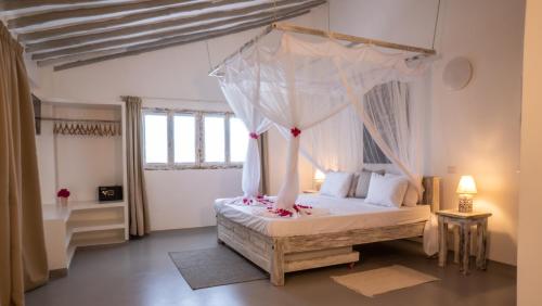 Postel nebo postele na pokoji v ubytování Casamia Suites