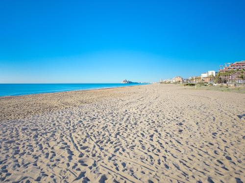 a sandy beach with footprints in the sand at Playa de Peñíscola - Ideal familias 6-7 pax o Parejas 2-4 pax - terraza - parking in Peniscola