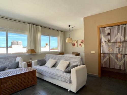 a living room with a bed and a couch at Ava Senia 4-1 in Begur