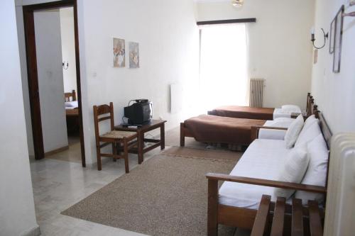 Tempat tidur dalam kamar di Aparthotel Iliahtides