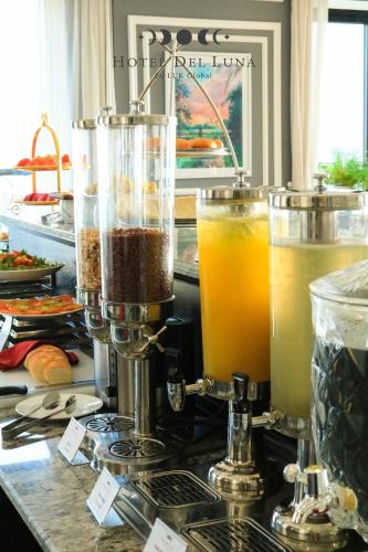 a kitchen counter with a blender and some drinks at Hotel Del Luna Boutique in Da Nang