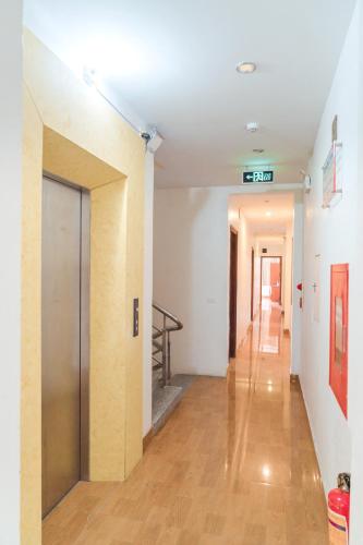 an empty hallway with a door in a building at Luxury Airport Hotel & Travel in Noi Bai