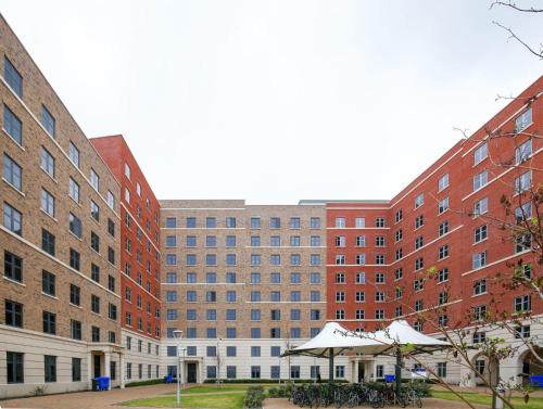 a row of brick buildings in a city at UPP Bay Campus Swansea in Swansea