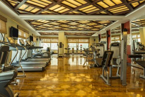 a gym with treadmills and elliptical machines at Sofitel Dubai Jumeirah Beach in Dubai
