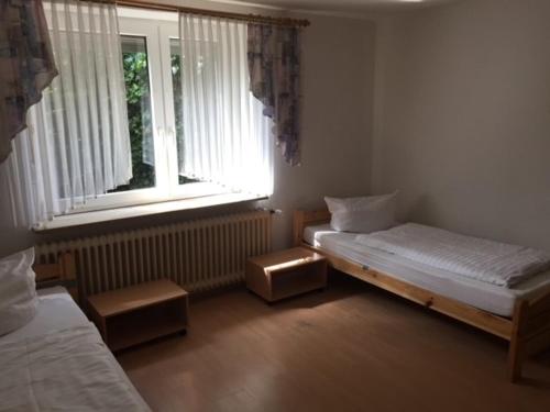 WH Monteurhotel Papenburg Nordにあるベッド