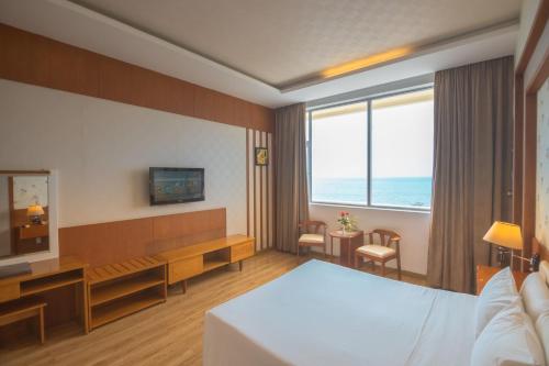 Postel nebo postele na pokoji v ubytování Sammy Hotel